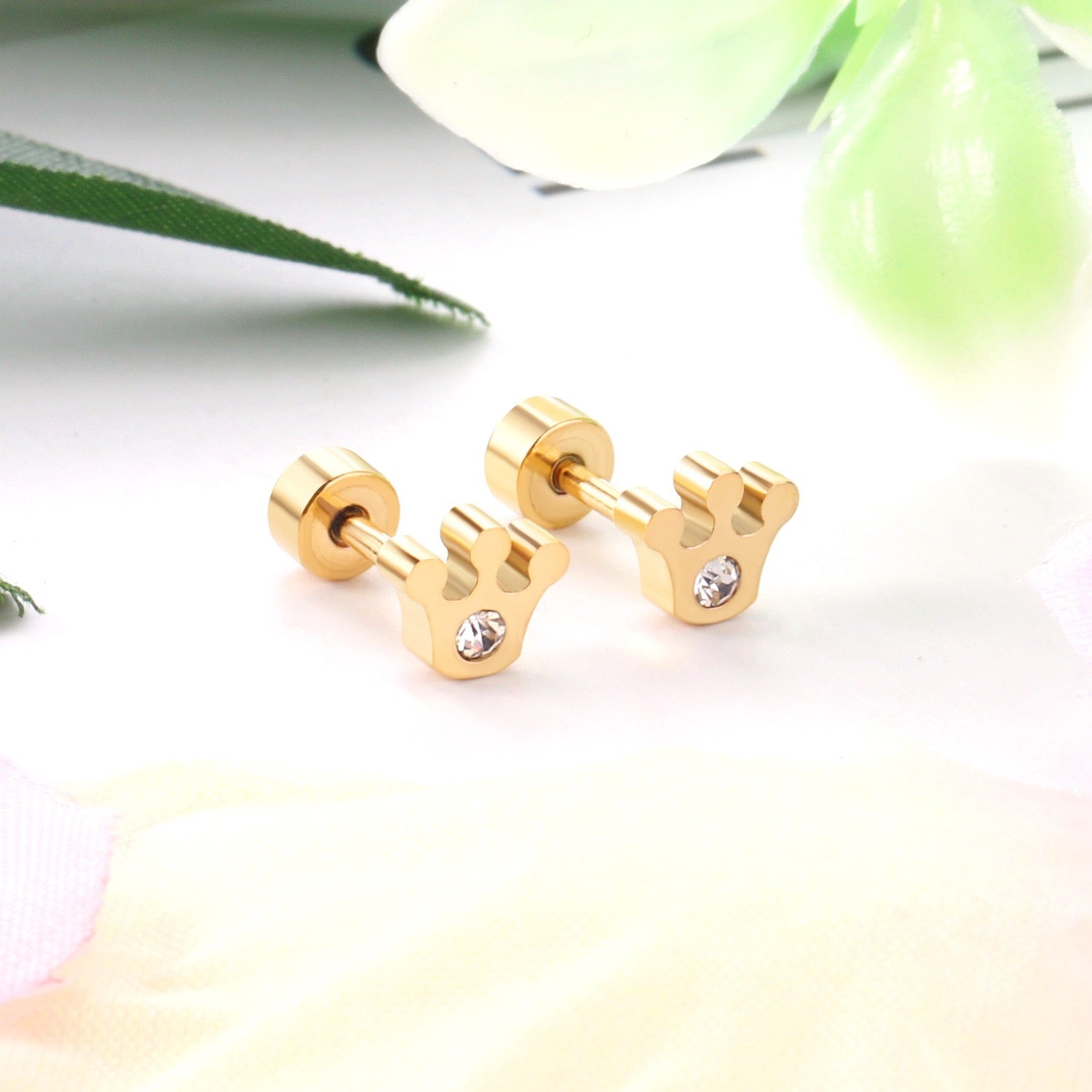 Sparkle Crown gold earrings flat lay – poke free children's earrings by Twisty Locks