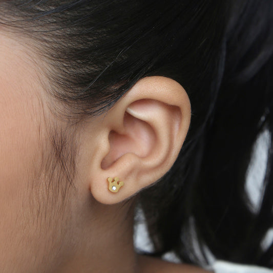 Girl wearing Sparkle Crown gold earrings – kids jewellery by Twisty Locks